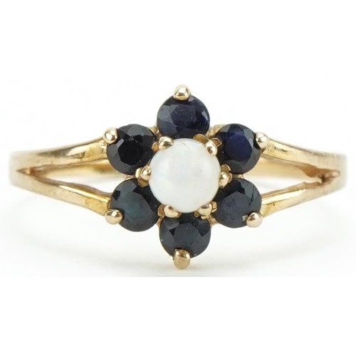 3403 - 9ct gold cabochon opal and spinel flower head ring with split shoulders, size L, 1.2g