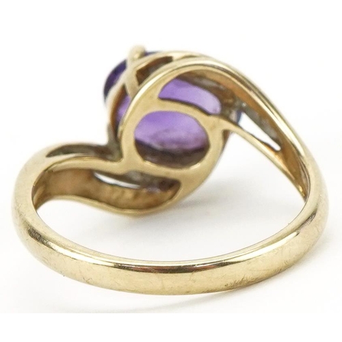 3090 - 9ct gold amethyst and diamond crossover ring, size L, 2.6g