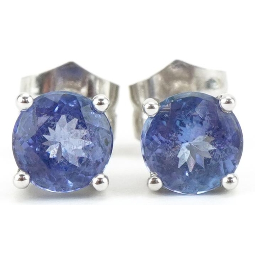 3242 - Pair of 18ct white gold iolite solitaire stud earrings, 6.20mm in diameter, 2.0g