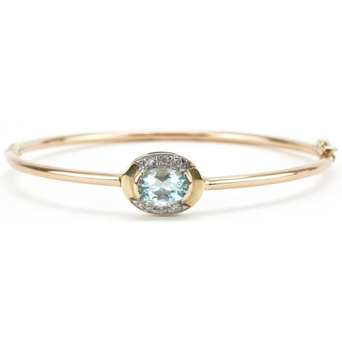 3030 - 9ct gold blue topaz and diamond hinged bangle, 6cm in diameter, 5.0g