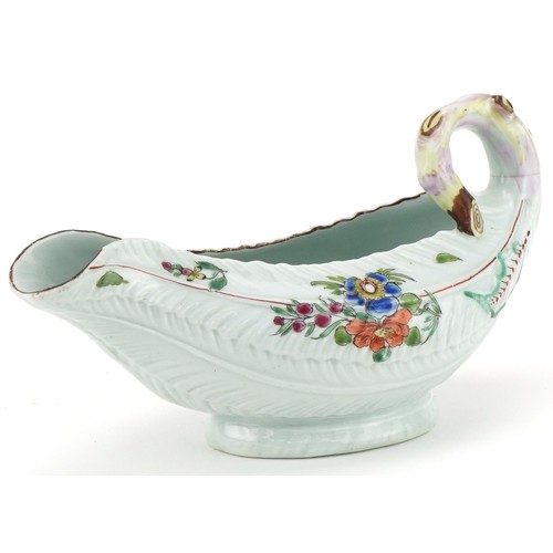 1038 - 18th century Worcester porcelain sauce boat hand painted with flowers, 19cm in length