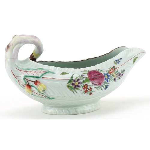 1038 - 18th century Worcester porcelain sauce boat hand painted with flowers, 19cm in length