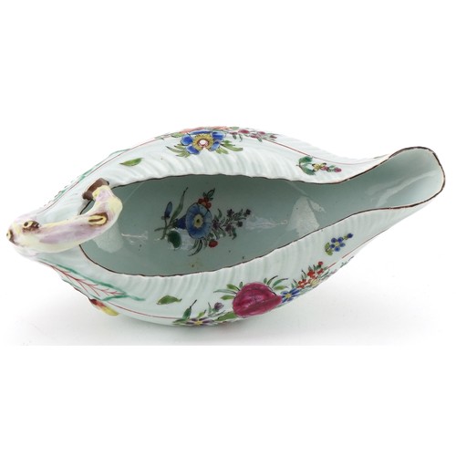 1038 - 18th century Worcester porcelain sauce boat hand painted with flowers, 19cm in length