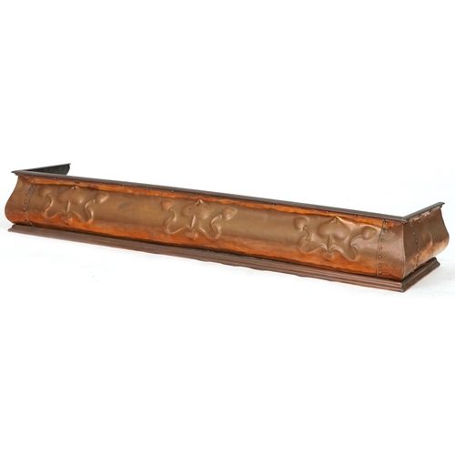 640 - Arts & Crafts copper fire kerb with stylized flowers, 126cm wide x 26cm deep