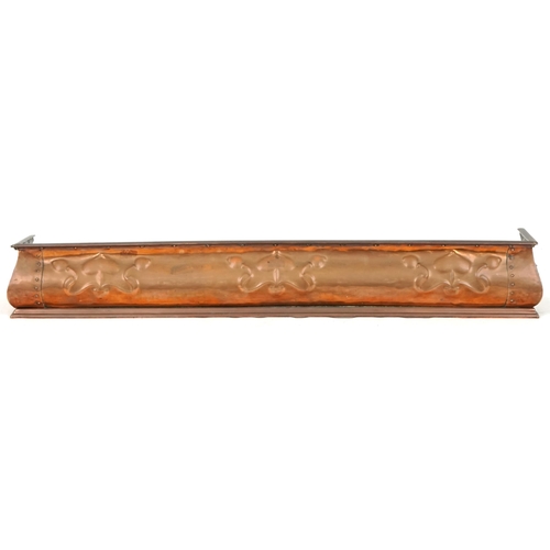 640 - Arts & Crafts copper fire kerb with stylized flowers, 126cm wide x 26cm deep