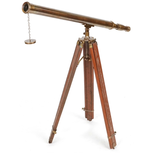 2220A - Floor standing brass telescope with adjustable tripod base, the telescope 98cm in length