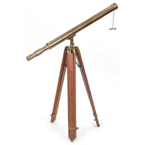 2220A - Floor standing brass telescope with adjustable tripod base, the telescope 98cm in length