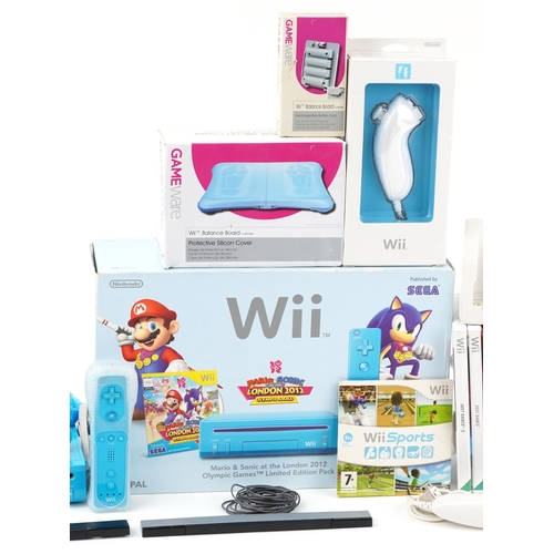 2376 - Two Nintendo Wii games consoles with accessories and a collection of games