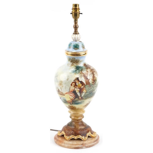 2258 - Italian porcelain table lamp hand painted with a courting couple, raised on an onyx base, overall 55... 