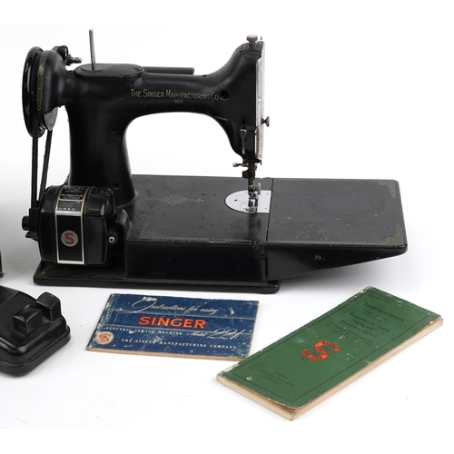 2304 - Vintage electric Singer sewing machine with case