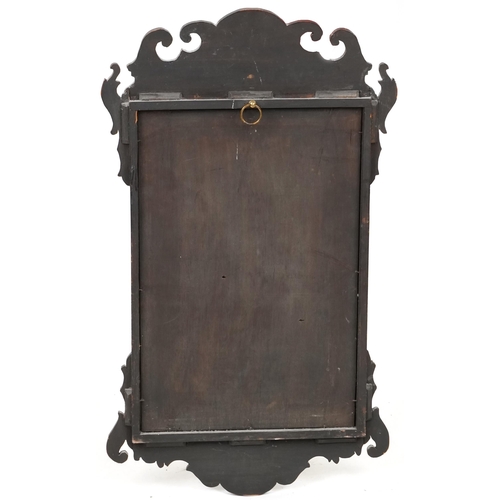 743 - Late 20th century mahogany fretwork wall mirror with inner gilt slip, 70cm x 40cm