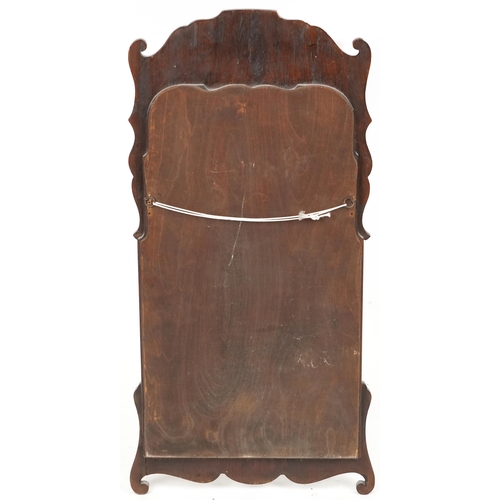 742 - Late 20th century Queen Anne style walnut fretwork wall mirror with inner gilt slip, 80cm x 40cm