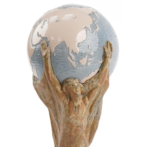 1390 - Football interest Lladro FIFA world cup trophy mounted on a wooden base, 40cms high (Collected by Di... 