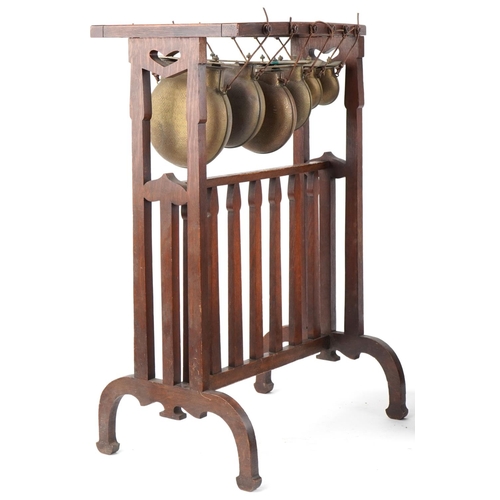 36 - Liberty's oak Arts and Crafts xylophone with six brass gongs along with an similar incomplete  examp... 