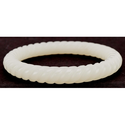 3355 - Chinese jade rope twist design bangle, 8.5cm in diameter, 48.0g