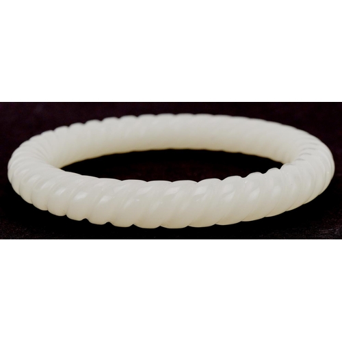 3355 - Chinese jade rope twist design bangle, 8.5cm in diameter, 48.0g