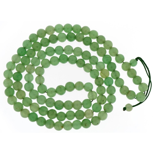 3129 - Chinese green jade bead necklace, each bead approximately 9.8mm in diameter, overall 102cm in length... 