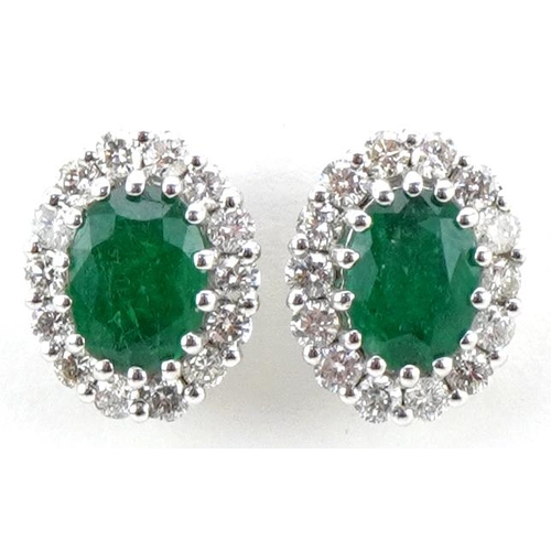 3181 - Pair of 18ct gold emerald and diamond cluster stud earrings, total diamond weight approximately 0.65... 