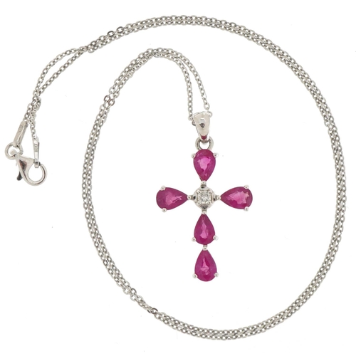 3370 - 9ct white gold ruby and diamond cross pendant on a silver necklace, total diamond weight approximate... 