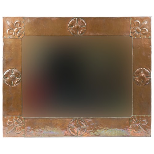 79 - Arts & Crafts copper mirror with Fleur de Lys decoration, 78cm x 62cm