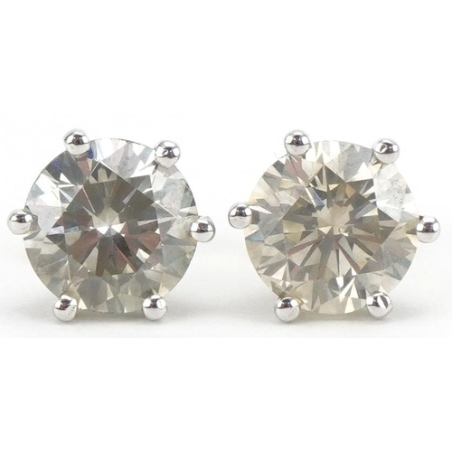 3013 - Pair of 18ct white gold round brilliant cut diamond solitaire stud earrings with certificate, total ... 