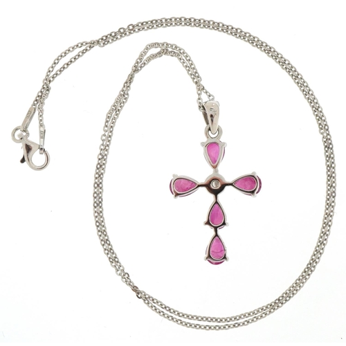 3370 - 9ct white gold ruby and diamond cross pendant on a silver necklace, total diamond weight approximate... 