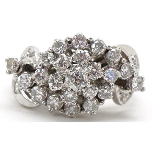 3192 - White metal diamond flower head cocktail ring, total diamond weight approximately 1.10 carat, size O... 