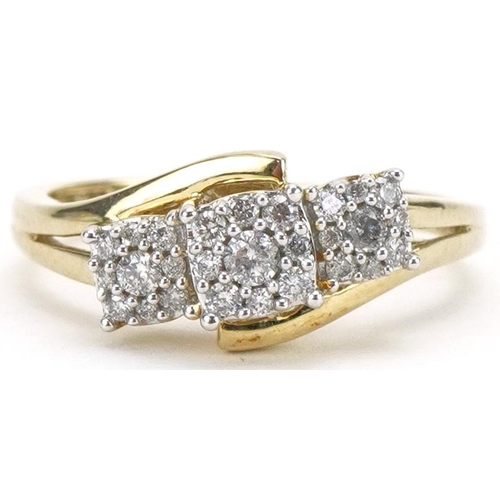 3105 - 9ct gold triple cluster diamond crossover ring, total diamond weight approximately 0.25 carat, size ... 