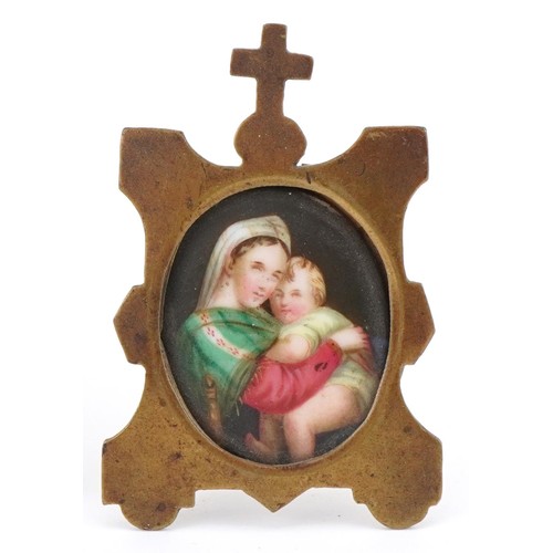 1385 - Hand painted porcelain plaque of Christ mounted in a brass easel frame together with a porcelain pla... 