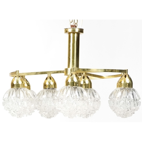 753 - Vintage brass chandelier with nine globular glass shades, 55cm in diameter