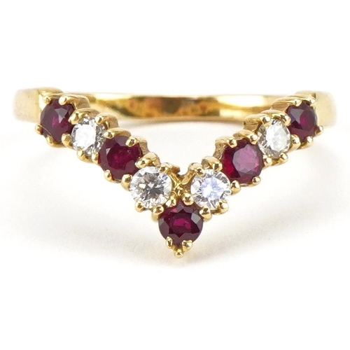 3384 - 18ct gold diamond and ruby wishbone ring, the larger diamonds each approximately 2.30mm in diameter,... 