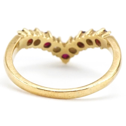 3384 - 18ct gold diamond and ruby wishbone ring, the larger diamonds each approximately 2.30mm in diameter,... 