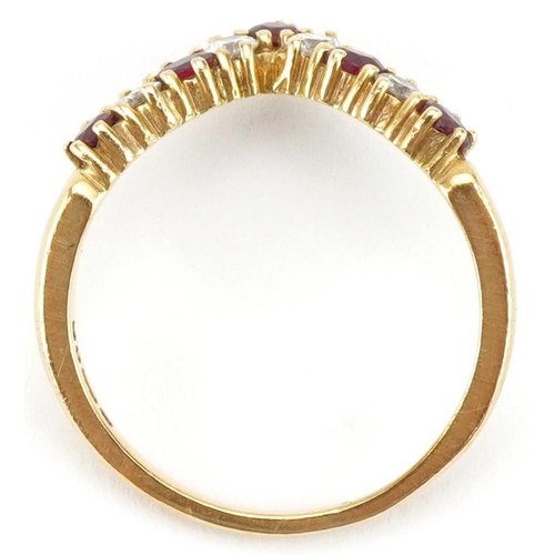 3384 - 18ct gold diamond and ruby wishbone ring, the larger diamonds each approximately 2.30mm in diameter,... 