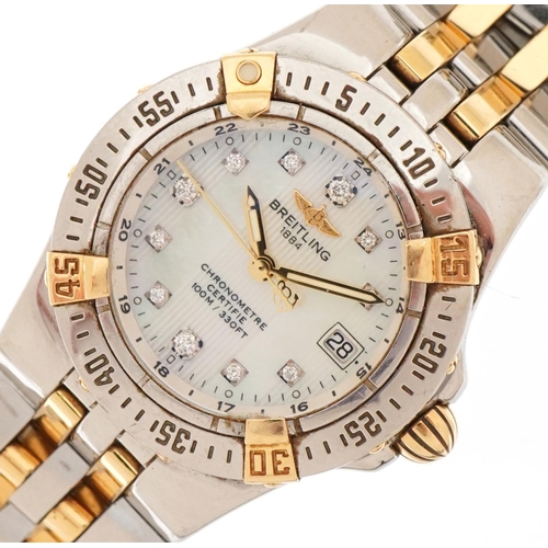 3023 - Breitling, ladies two tone Breitling chronometer wristwatch having diamond set mother of pearl dial ... 