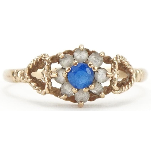 3033 - 9ct gold blue and clear stone flower head ring with love heart shoulders, size Q, 1.6g