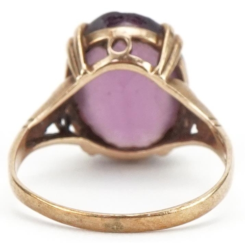 3378 - 9ct gold purple stone solitaire ring, size J, 2.6g