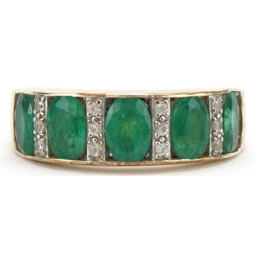 3035 - 9ct gold emerald and diamond ring set with five emeralds and twelve diamonds, size Q, 3.9g