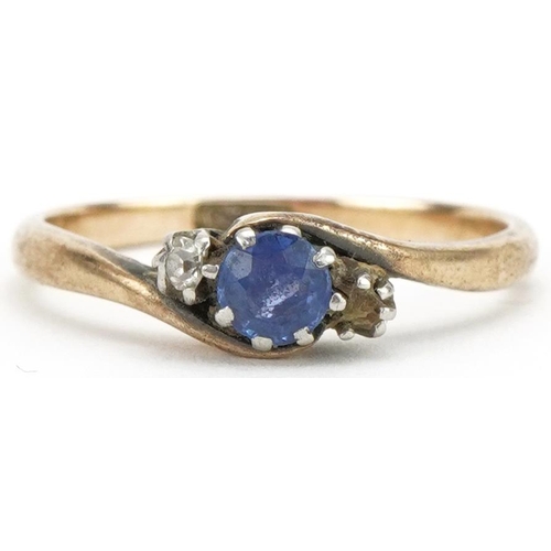 3073 - 9ct gold sapphire and diamond crossover ring, size O, 2.4g