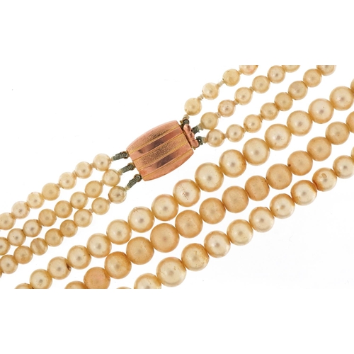 3252 - Simulated pearl three row necklace with 9ct gold clasp, 38cm in length