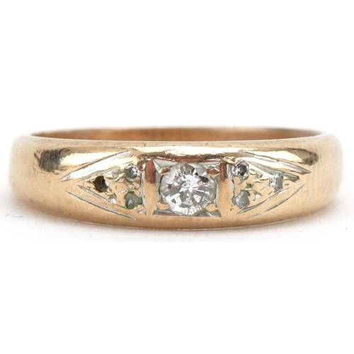 3299 - 9ct gold diamond ring, the central diamond approximately 2.20mm in diameter, size M, 2.7g