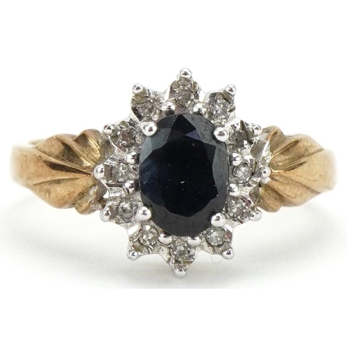 3359 - 9ct gold sapphire and diamond cluster ring, the sapphire approximately 7.0mm x 5.10mm x 3.20mm deep,... 