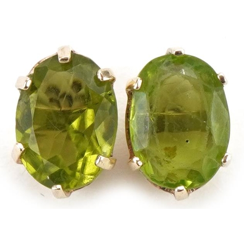 3154 - Pair of 9ct gold green stone stud earrings, 9mm high, total 1.0g