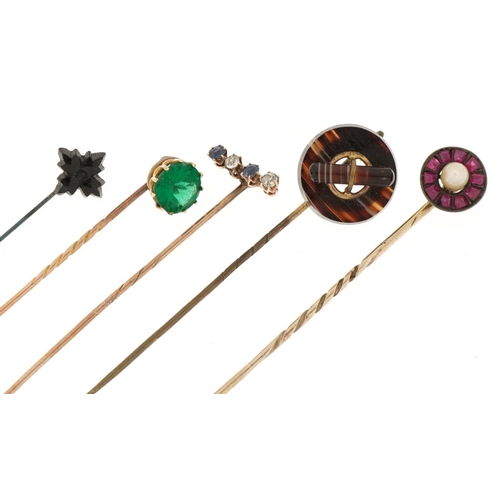 3170 - Five antique gold and yellow metal stickpins housed in three boxes including Scottish agate, diamond... 