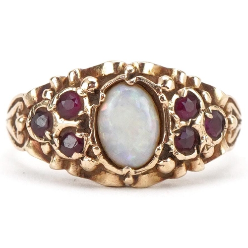 3303 - 9ct gold cabochon opal and pink spinel ring with ornate setting, size O, 3.9g