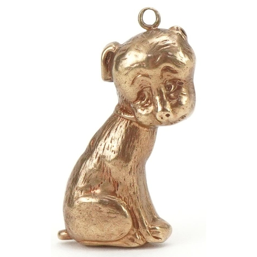 3225 - 9ct gold charm in the form of a seated dog, 2.6cm high, 1.5g