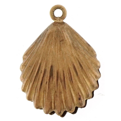 3268 - 9ct gold bell charm in the form of a shell, 1.7cm high, 0.7g