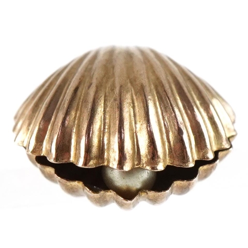 3268 - 9ct gold bell charm in the form of a shell, 1.7cm high, 0.7g