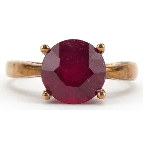 3125 - 9ct gold ruby solitaire ring, the ruby approximately 10.10mm in diameter x 6.50mm deep, size S, 4.0g