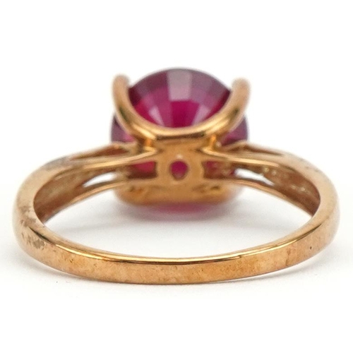 3125 - 9ct gold ruby solitaire ring, the ruby approximately 10.10mm in diameter x 6.50mm deep, size S, 4.0g