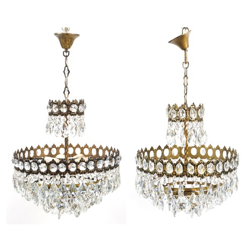 1111A - Pair of ornate gilt brass four tier chandeliers with cut glass drops, 42cm in diameter